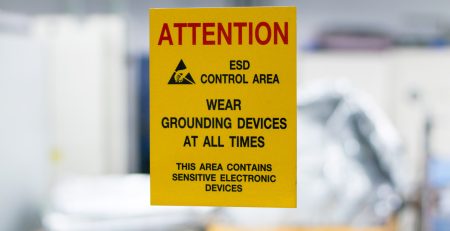 yellow attention sign to wear grounding devices